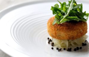 Salmon fish cakes with rocket, capers and lime dressing