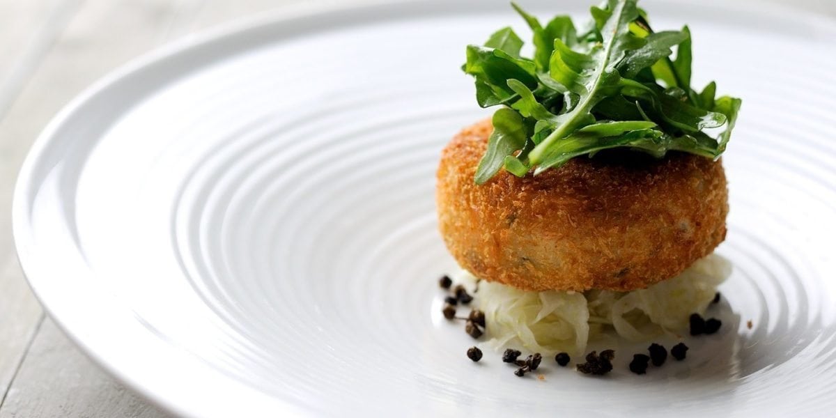 Salmon fish cakes with rocket, capers and lime dressing