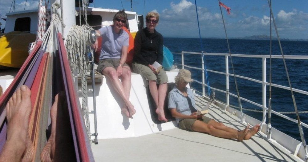 SUE BURPEE AND HER HUSBAND ON A SAILING ECO-CRUISE IN NEW ZEALAND.