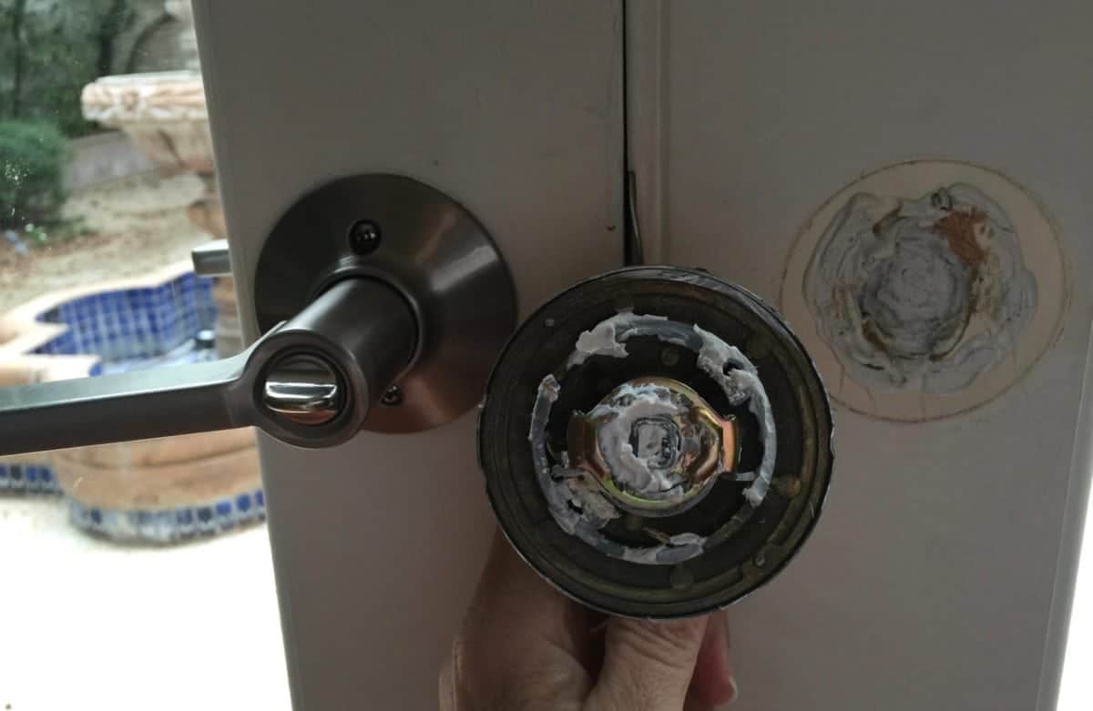 House flippers were either too lazy or too stupid to screw the other door handle into the door. Instead they used caulking and when that didn't work, they scotch taped the door knob to the door.