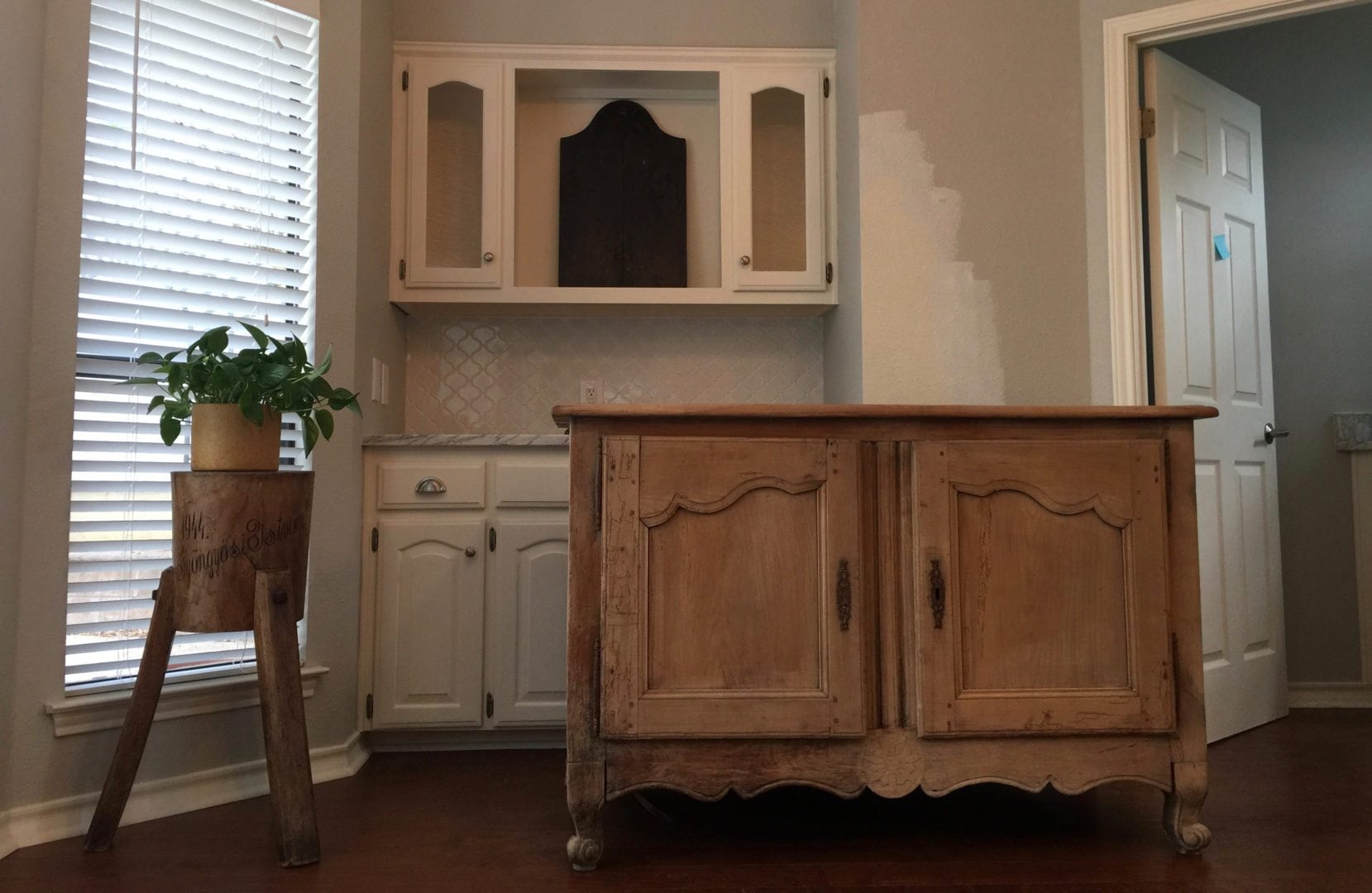Removing the upper glass cabinets, marble backsplash and the lower cabinets topped with marble.